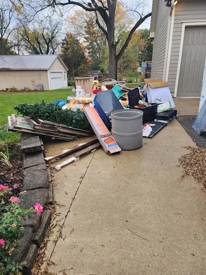 Dumpster being loaded with debris for 30 Yard Dumpster Rental in Lake Montezuma